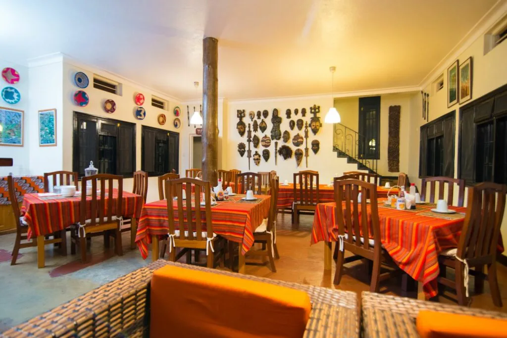 The guesthouse's dining room, decorated with African art and masks