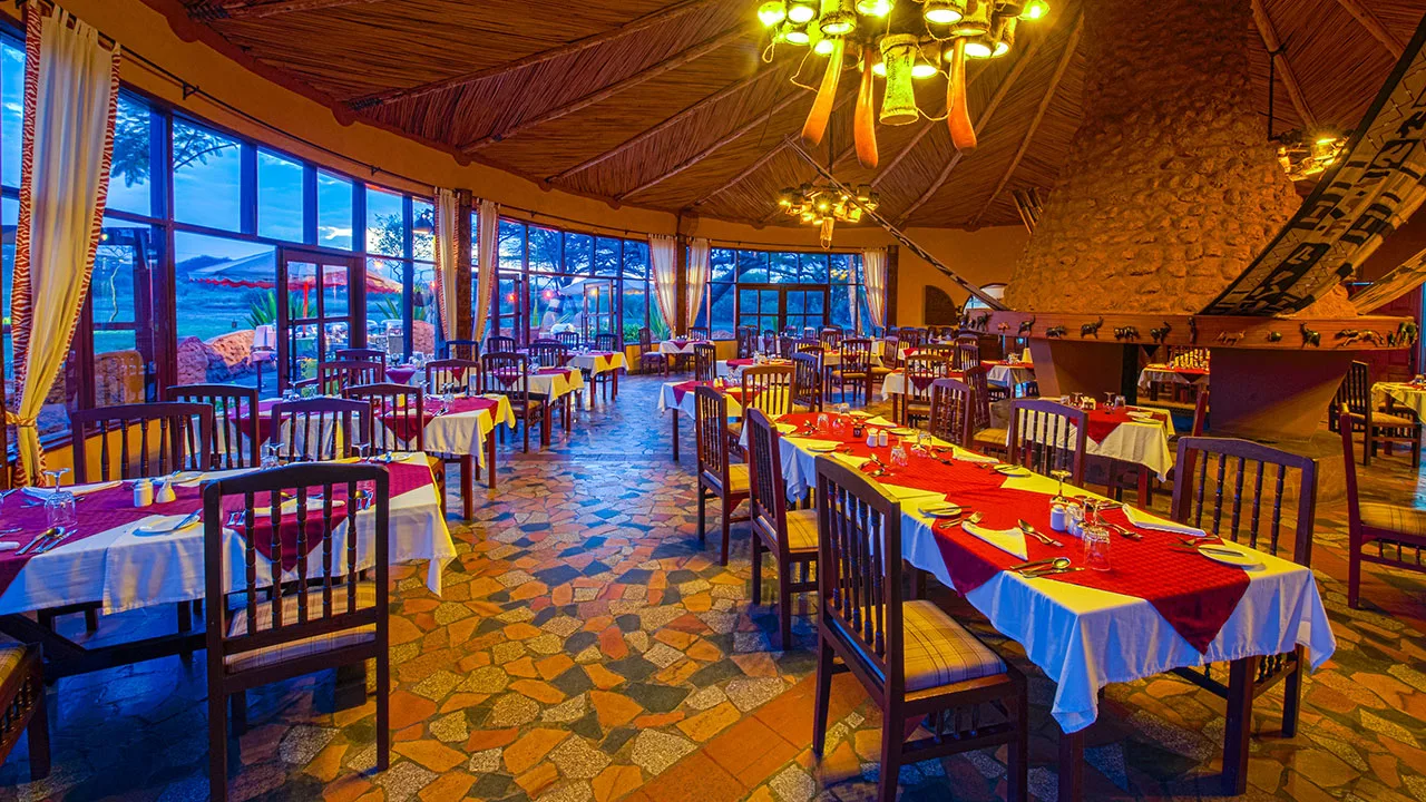 The lodge's main restaurant, serving international and local cuisine under a thatched roof