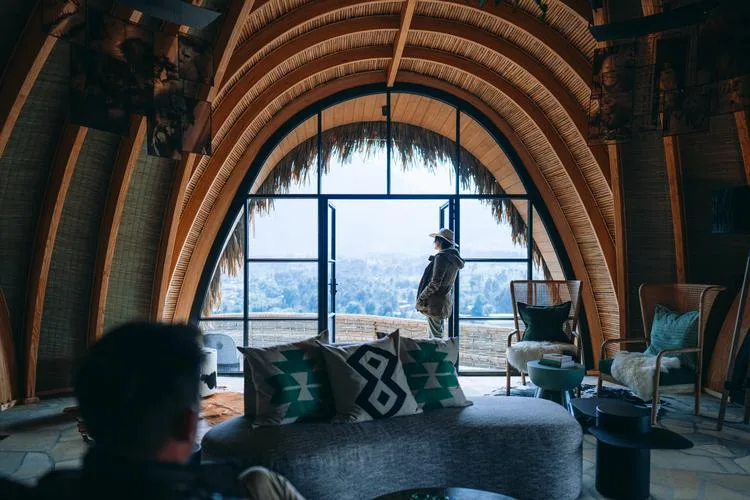 Each forest villa centres on a private stone fireplace for cool highland evenings.
