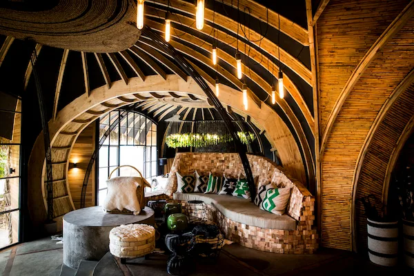 The lodge's woven-bamboo lounge and library, built by local craftspeople.