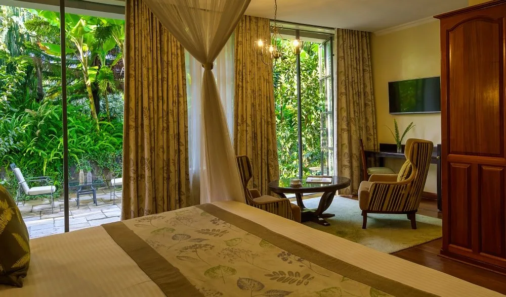 One of ten hand-crafted four-poster suites at this converted 1930s colonial manor.