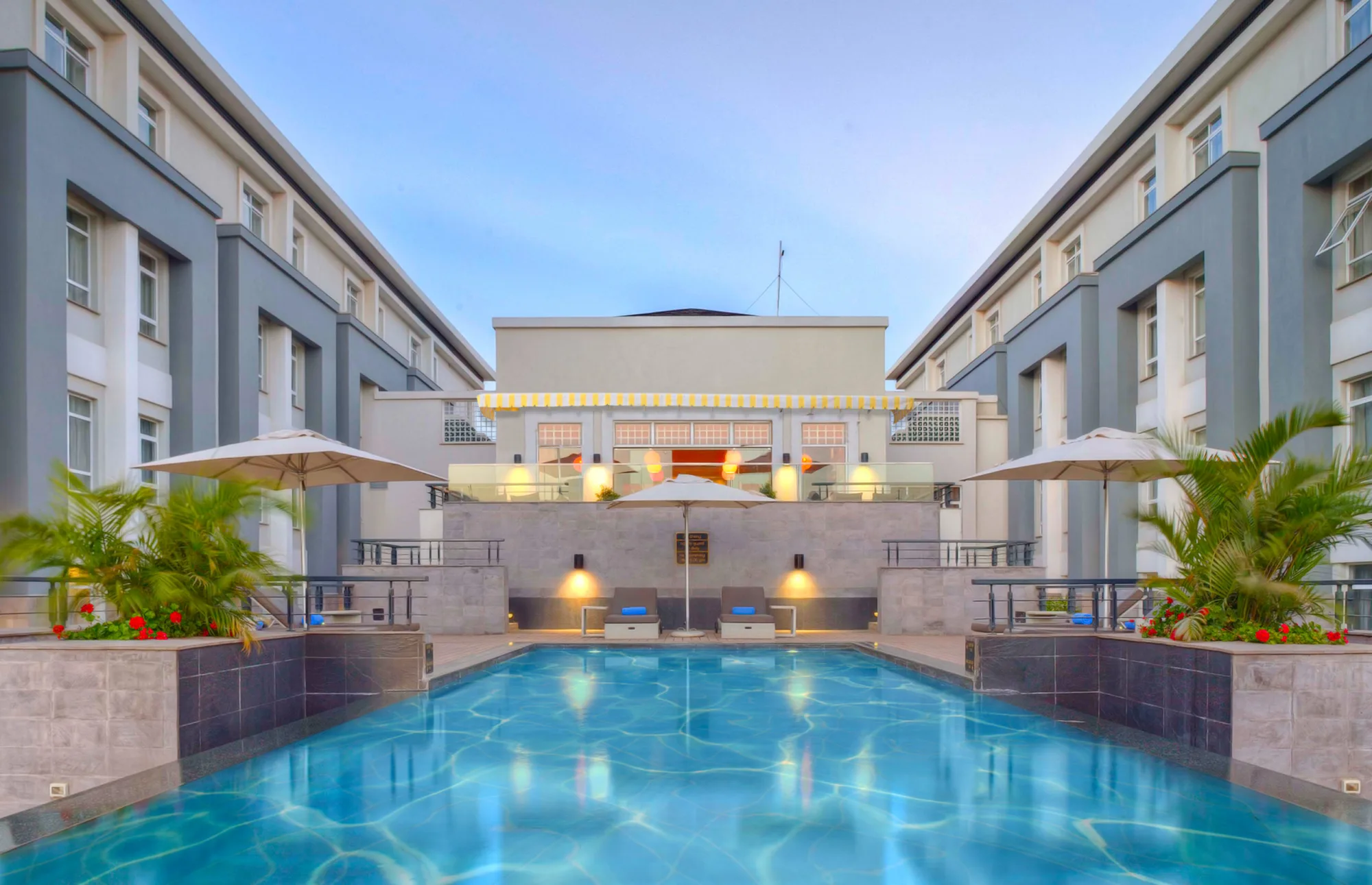 The courtyard pool is a quiet escape between meetings or safari transfers.