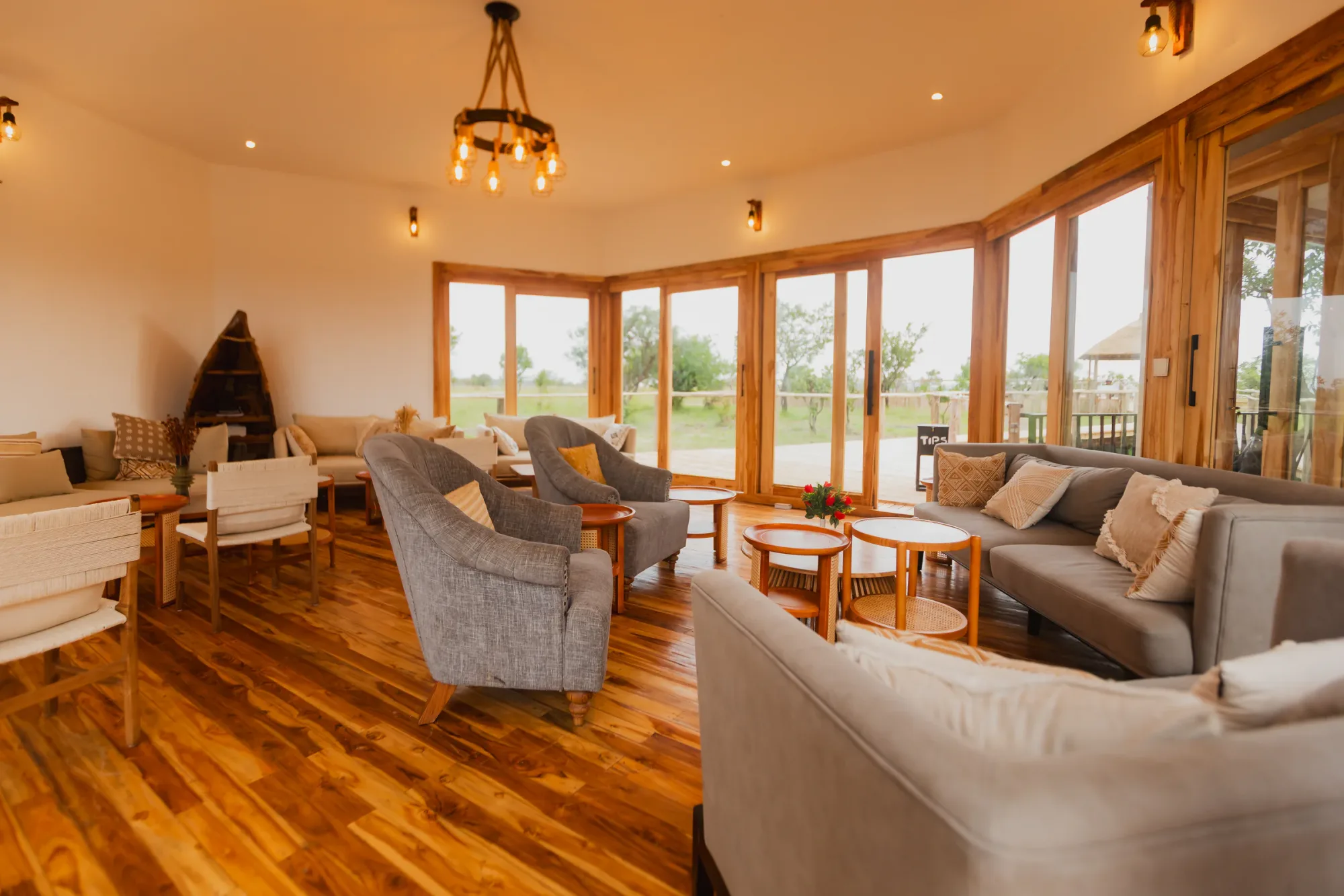 The communal lounge's wraparound windows frame the surrounding plains.