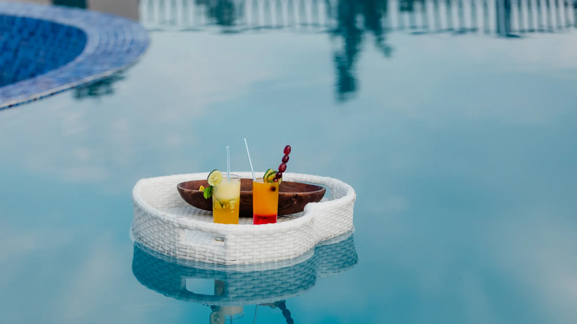 A poolside cocktail service adds a playful touch between game drives.