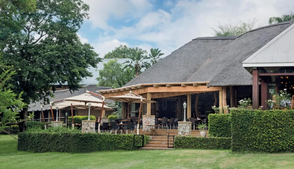 The estate's restaurant building set among indigenous Lowveld gardens.