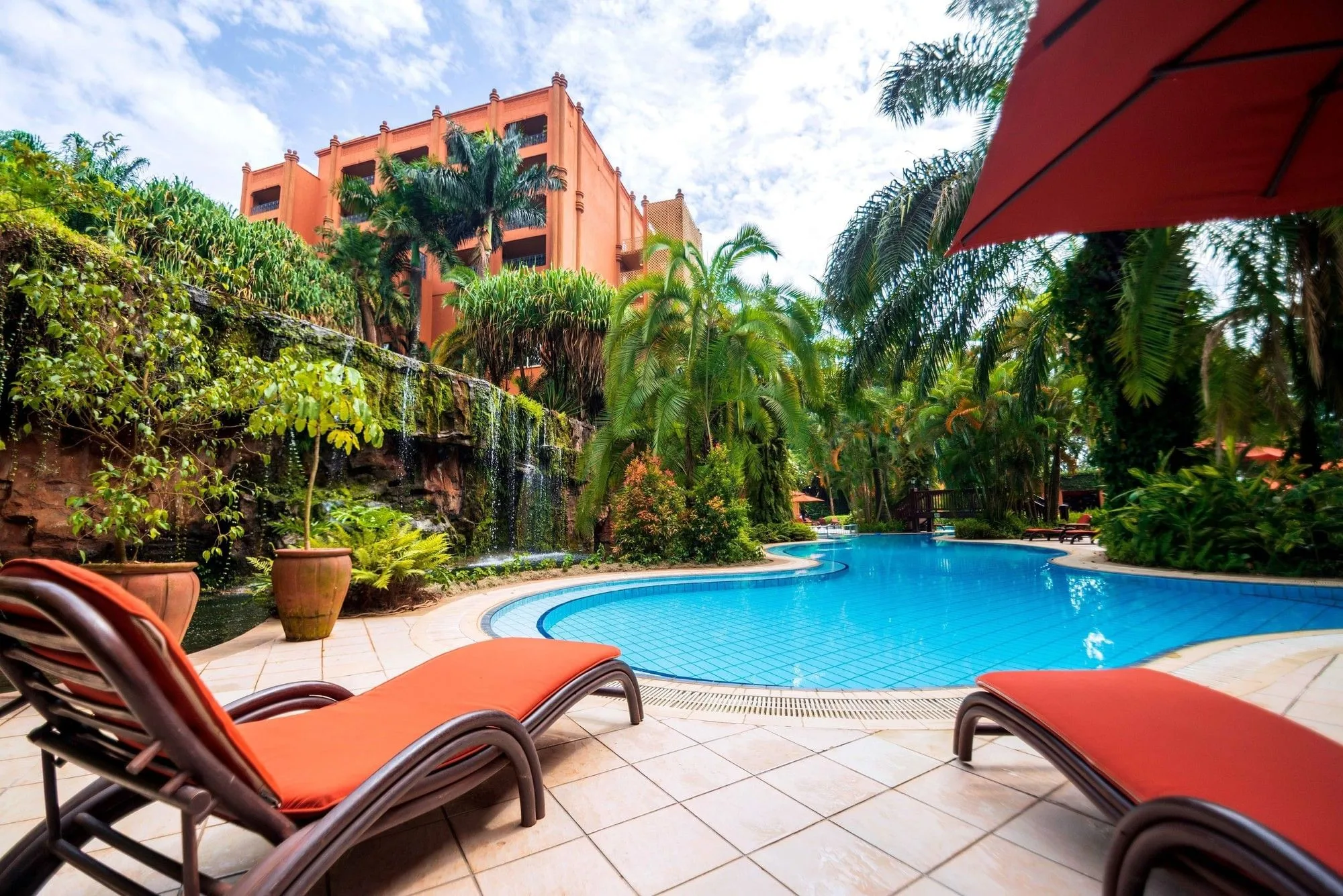 The hotel's tropical-style outdoor swimming pool
