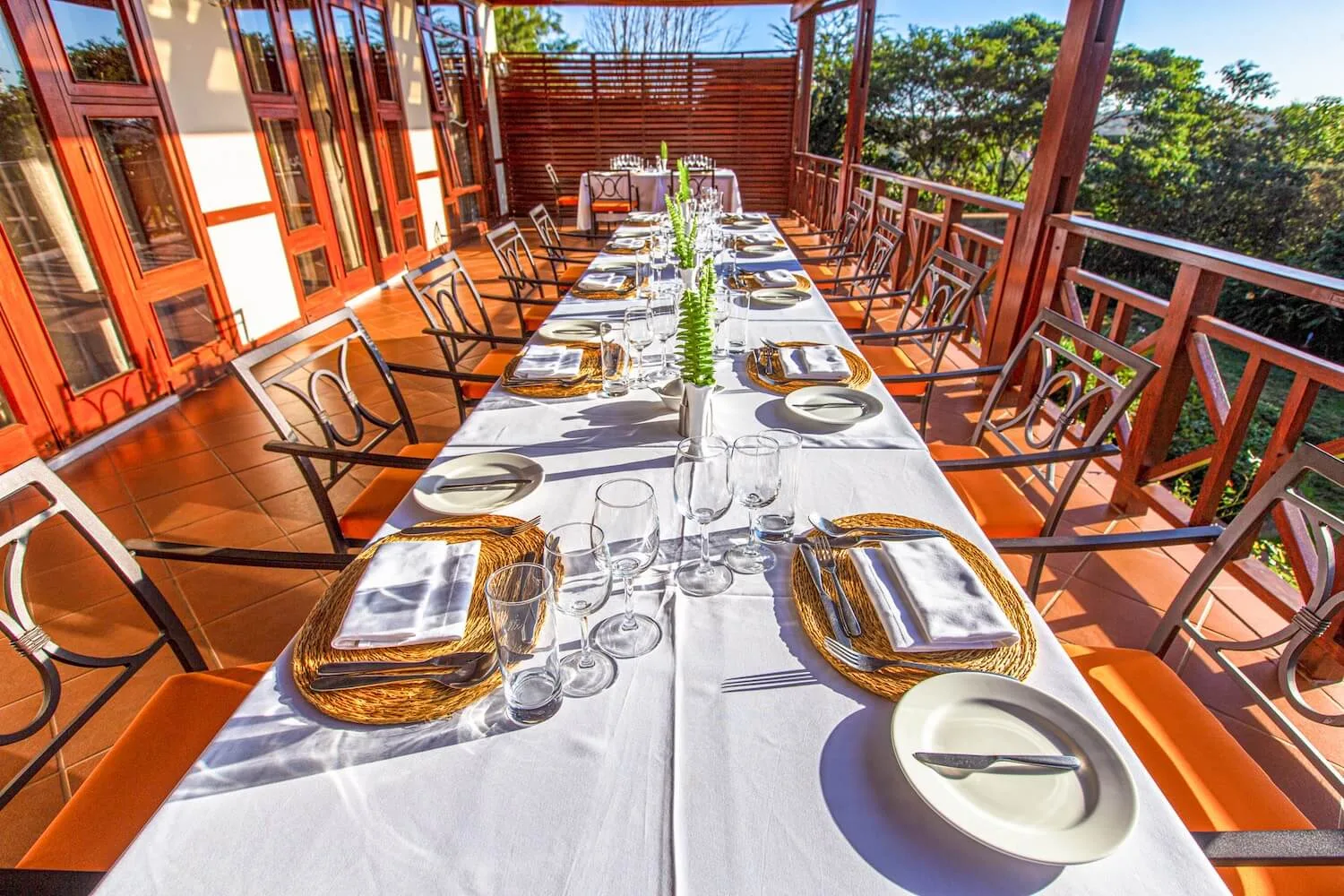 Al fresco dining on the lodge's terrace, overlooking the surrounding countryside.