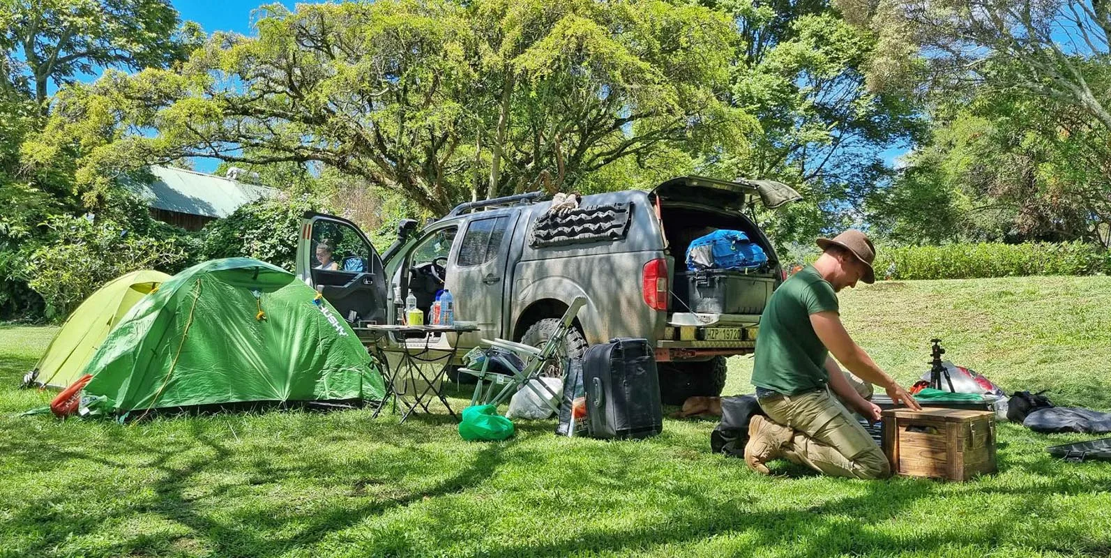 Shaded grass camping pitch