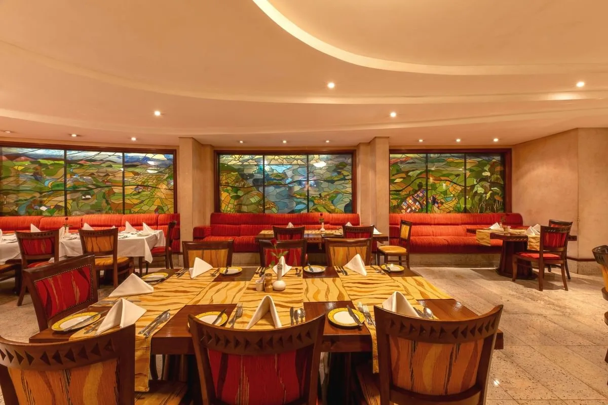 Milima Restaurant, the hotel's all-day garden-atrium dining venue.