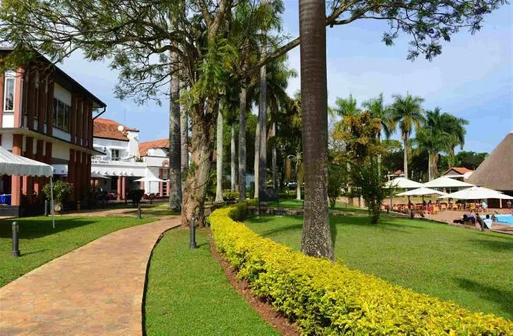 Manicured lakeside gardens connecting the hotel's grounds