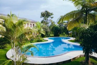 The hotel's outdoor pool set among tropical gardens