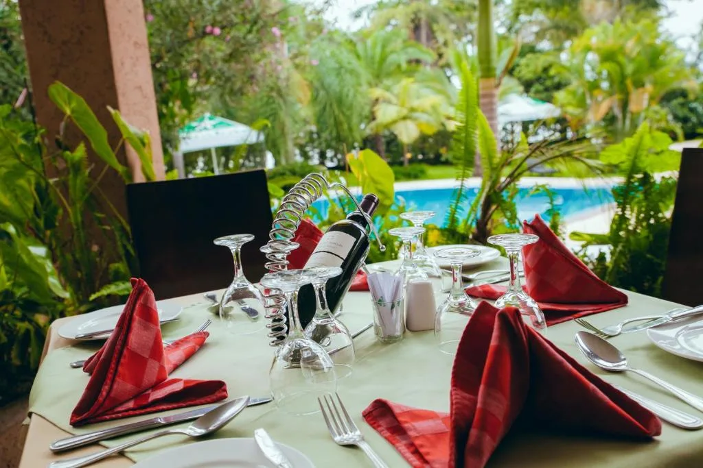Outdoor dining on the terrace overlooking the pool