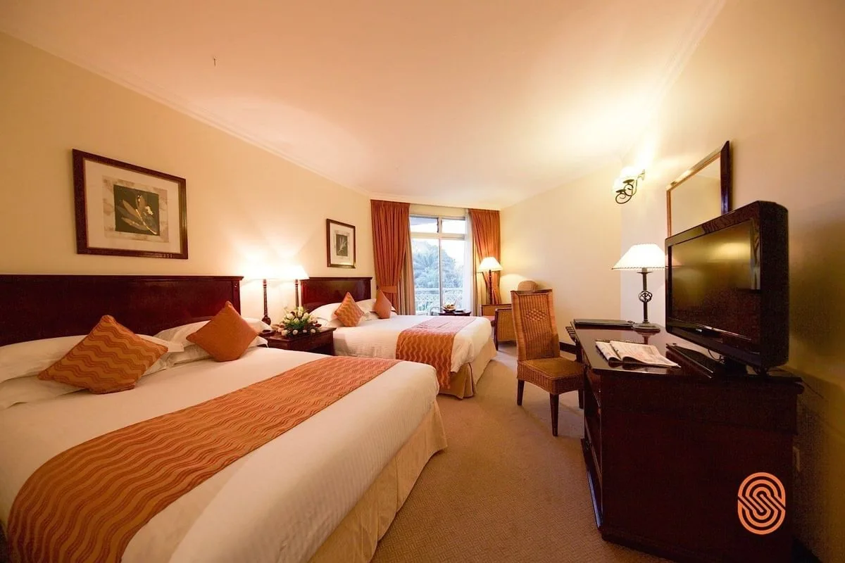 A Superior Twin Room with elegant Pan-African decor.