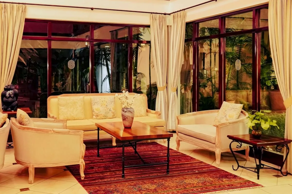 A quiet indoor lounge area overlooking the tropical courtyard.