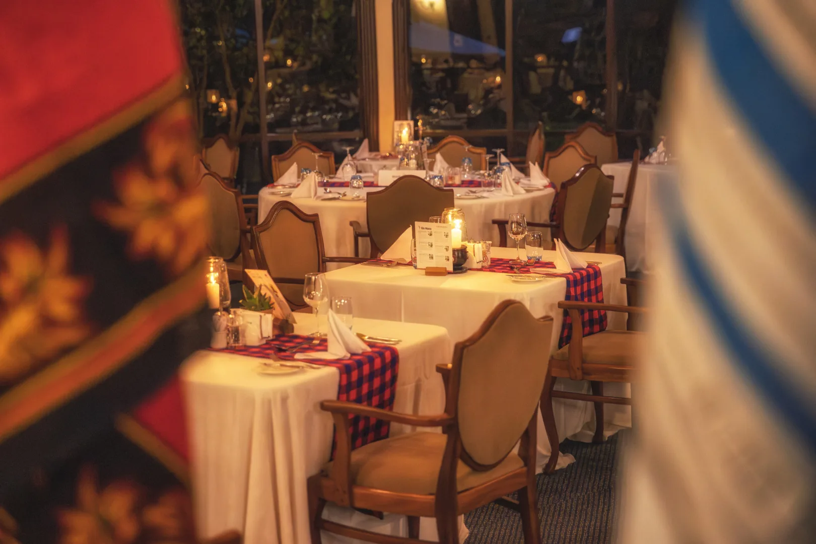 An intimate candlelit table setting for the lodge's Swahili-themed dinner evening