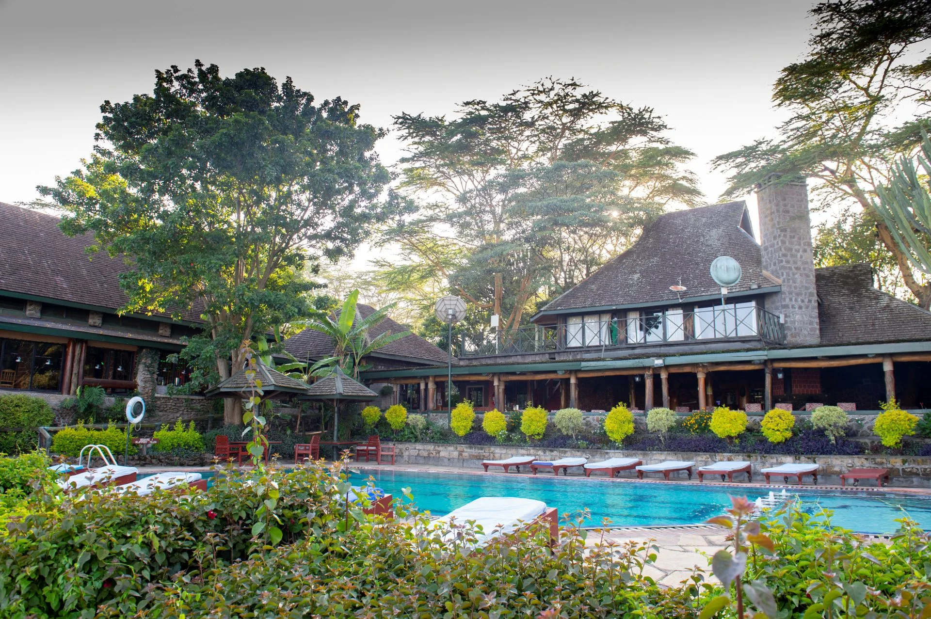 The lodge's main buildings and pool deck, set inside Lake Nakuru National Park