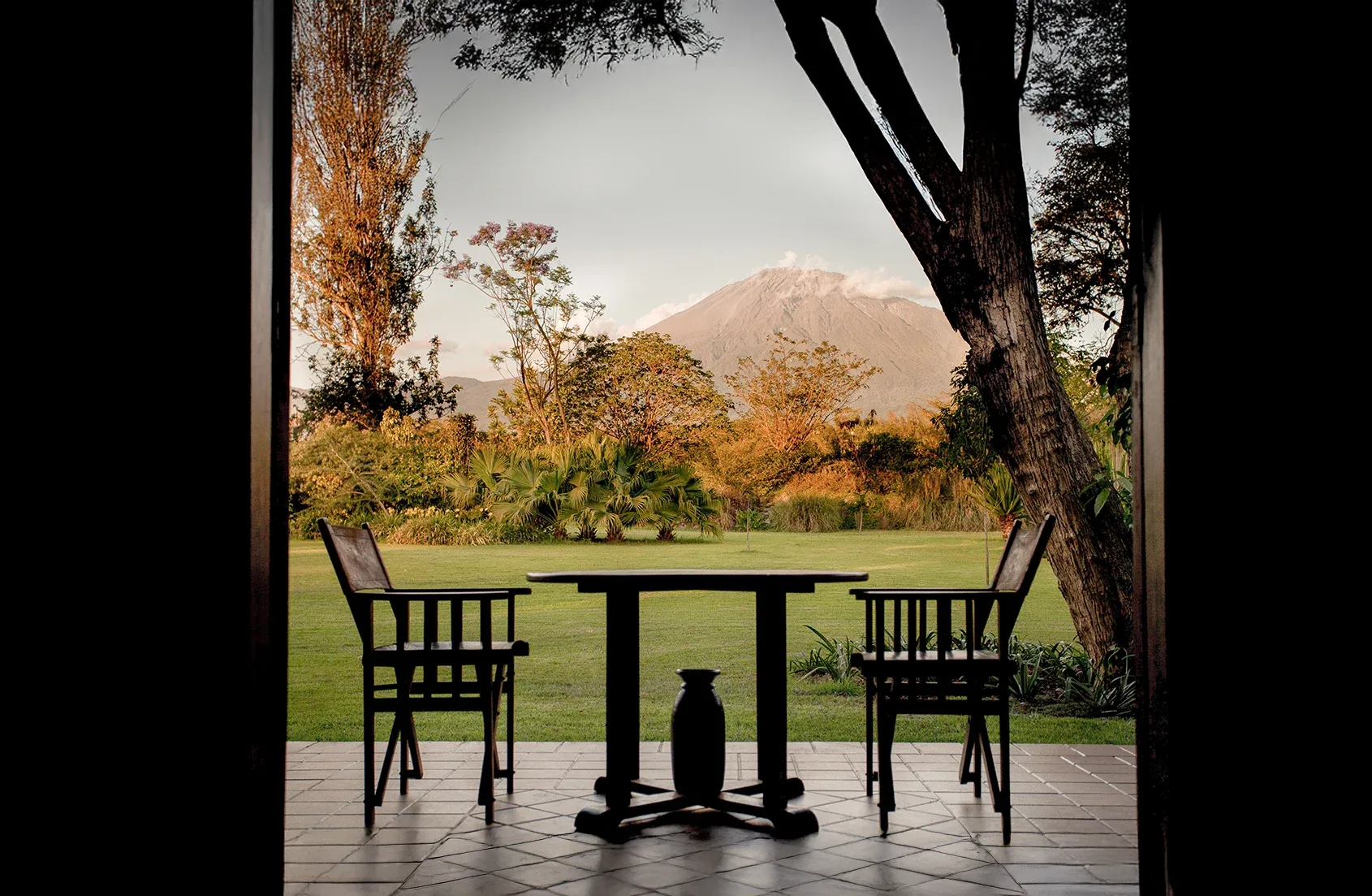 Sundowner views of Mount Meru from a private cottage veranda