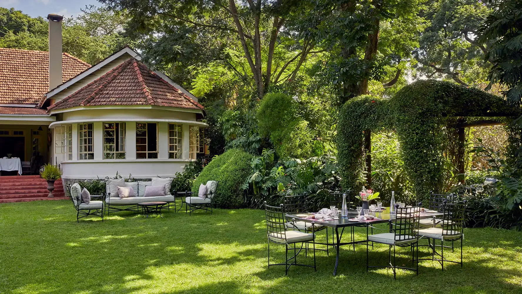 Outdoor lounge and dining area on the estate lawn