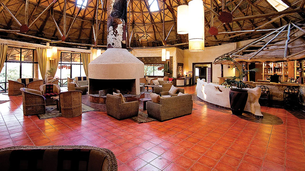 The lodge's signature round-house lounge centers on an open fireplace and full bar.