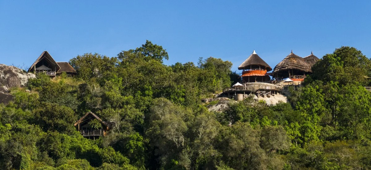 The lodge is built into a rocky hillside overlooking the bush of Lake Mburo National Park.