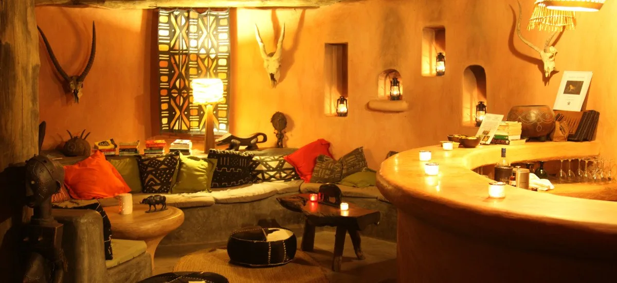 A cosy lantern-lit lounge and bar area for evening drinks.