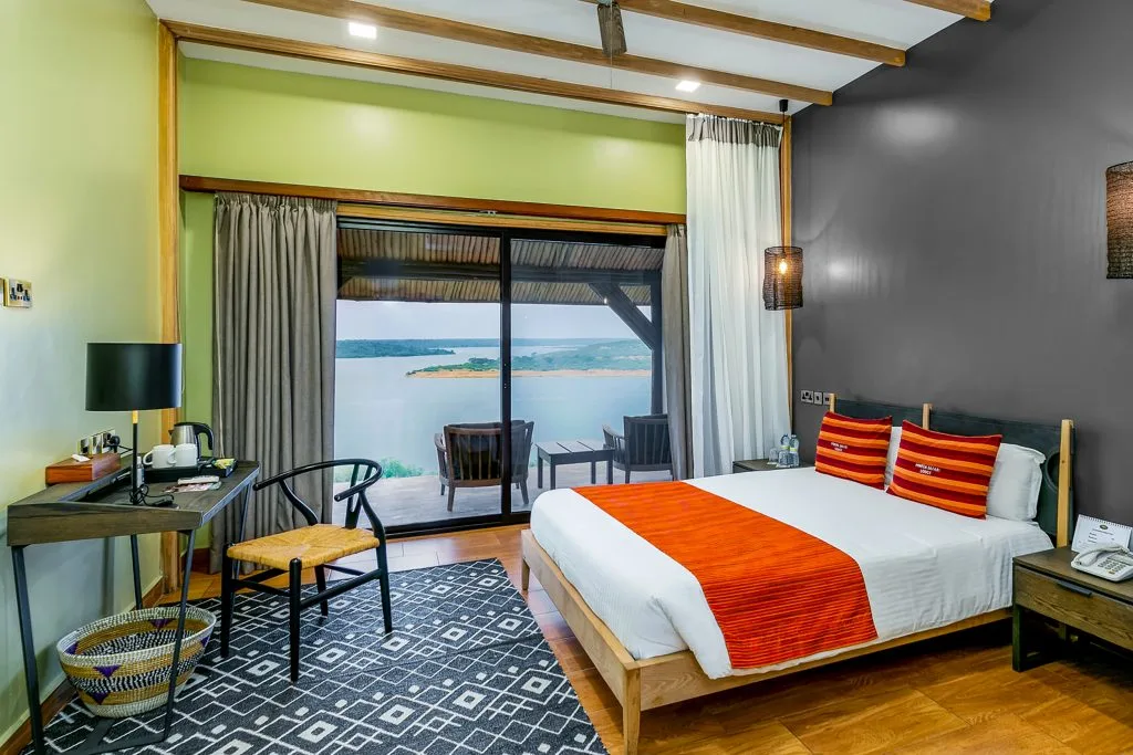 A Deluxe Room with double bed, private terrace, and channel views.