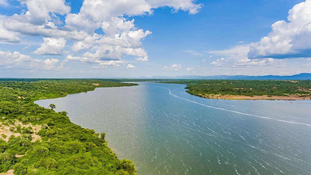 The Kazinga Channel, home to hippos, elephants, and abundant birdlife, seen from near the lodge.