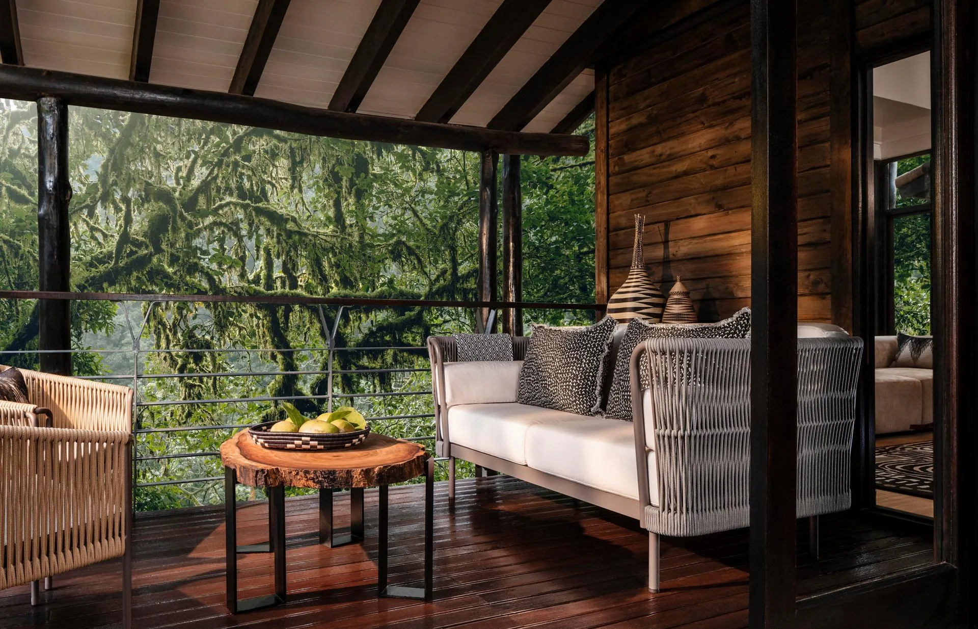 Each suite opens onto a private balcony with sweeping views of the surrounding forest.