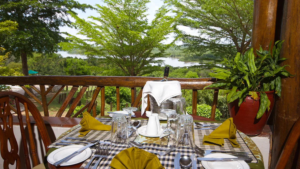 Terrace tables look directly out over the Nile as it winds through Murchison Falls National Park.