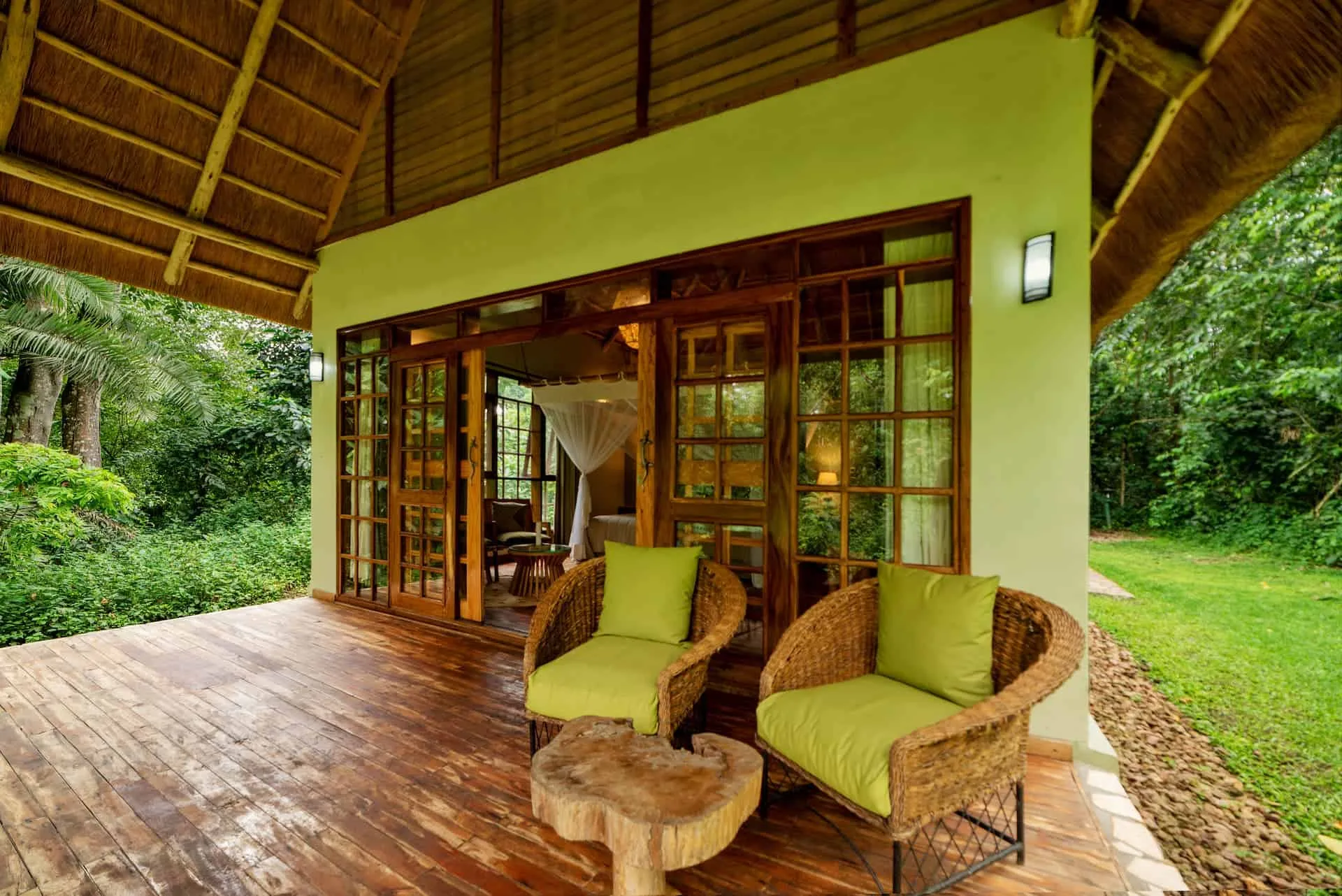 Cottages open onto private verandas tucked into the Kibale rainforest.