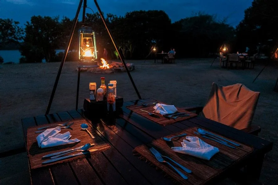 A signature starlit bush dinner experience under lantern light