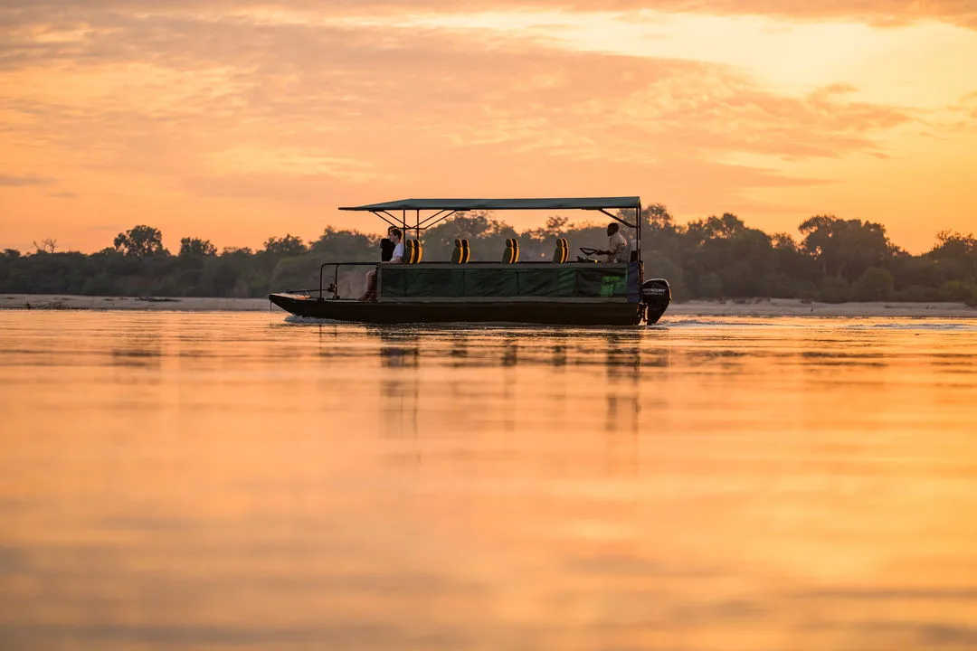 Golden-hour boat safaris are one of the camp's signature outings.