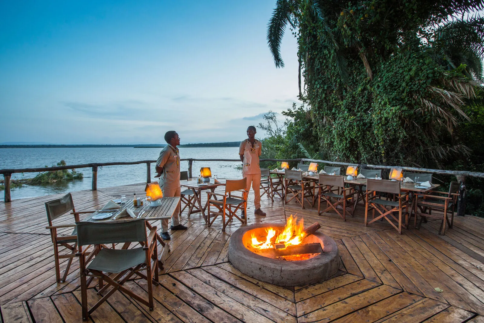 Open-air deck beside Lake Ihema at dusk