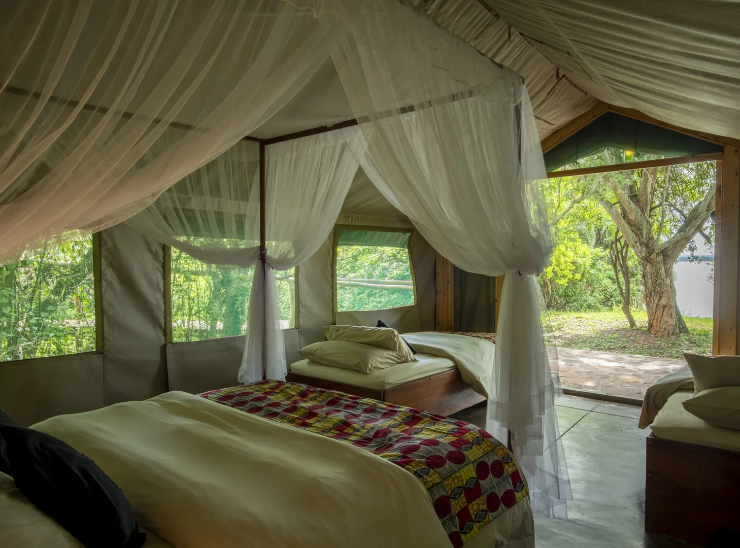 Family tent surrounded by riverine forest