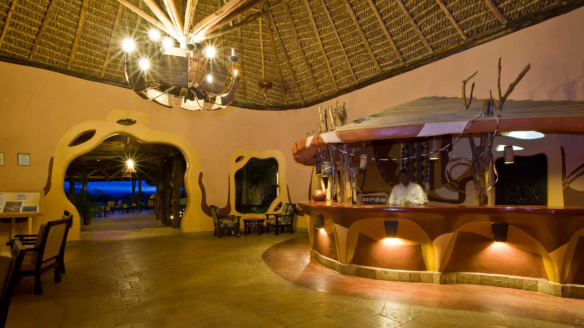 The lodge's circular reception and lounge showcase Samburu-inspired architecture and decor.
