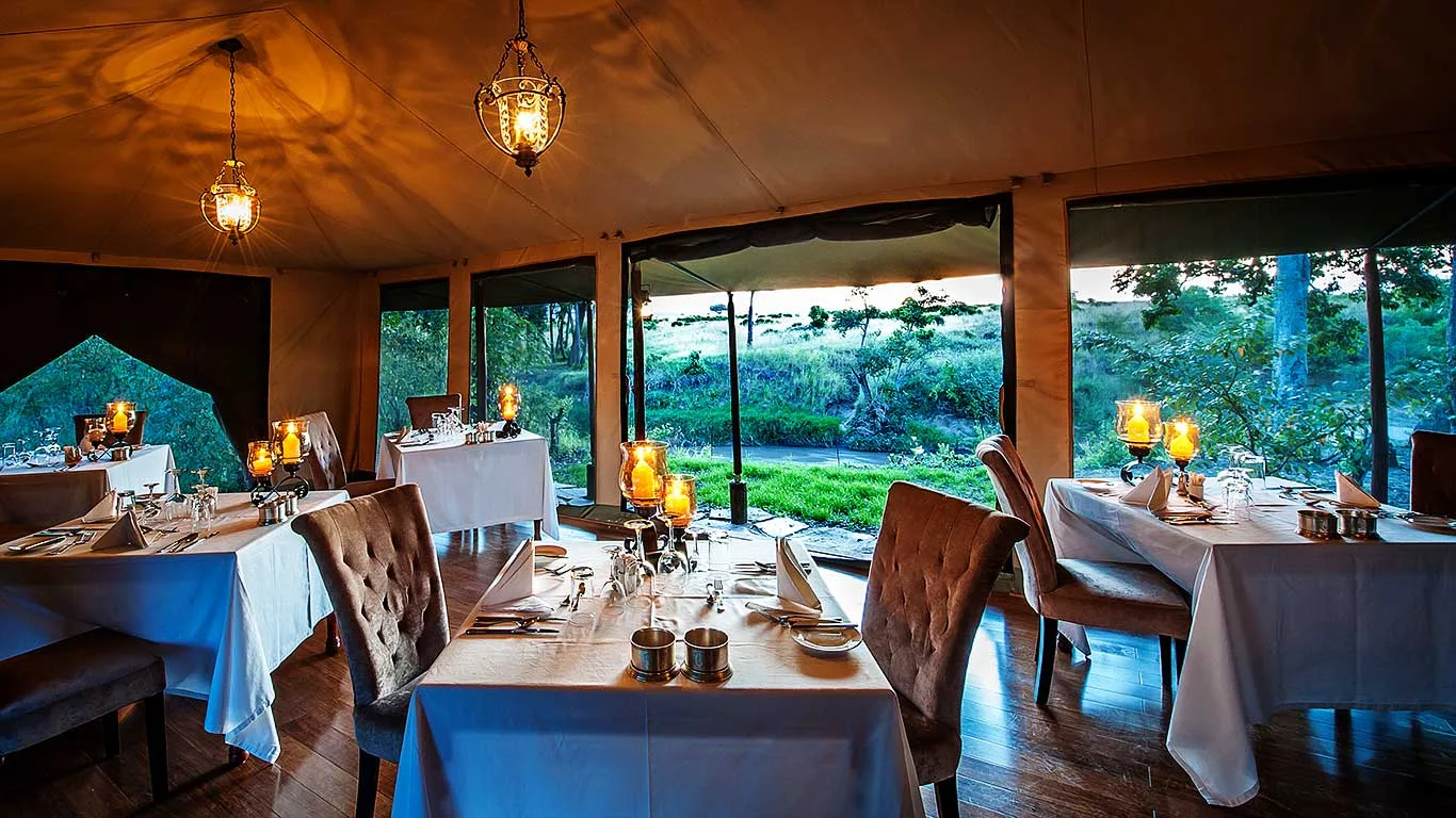Dinner is served with open views onto the Mara plains.