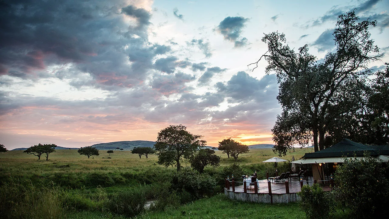 The camp deck overlooking the Sand River at dusk.