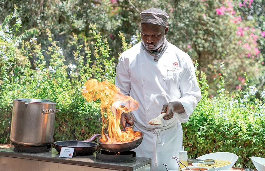 Live cooking stations feature at the lodge's garden dining experiences.