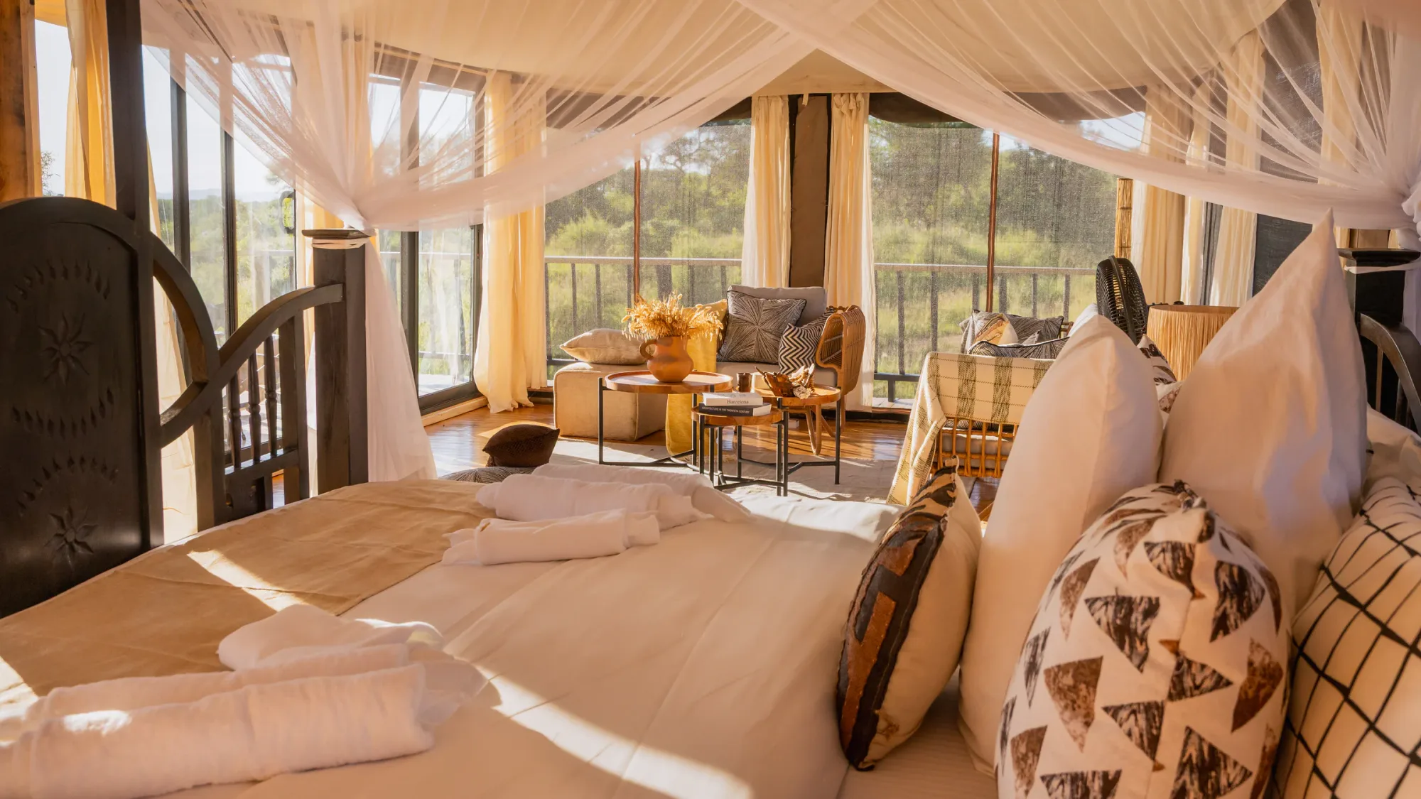 Lantern-lit tents come alive at dusk overlooking the Tarangire savanna.