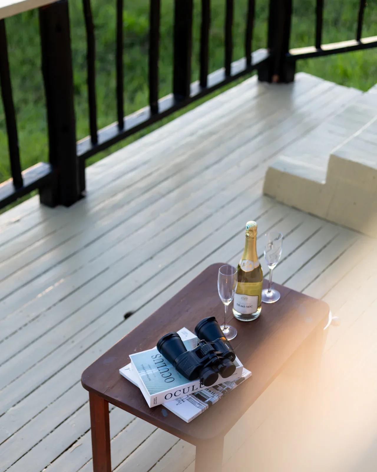 In-room touches like binoculars and champagne prepare guests for the next game drive.