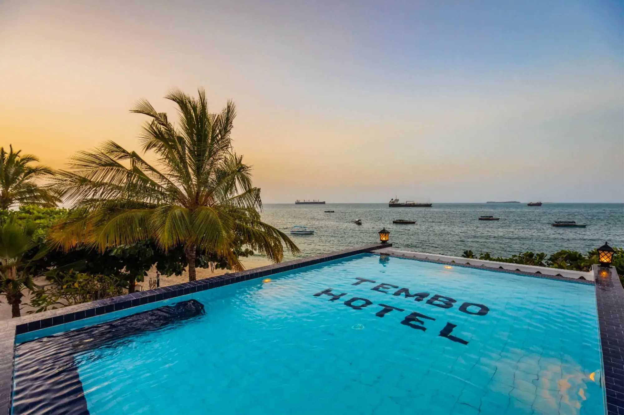 The rooftop pool deck looks straight out over the Stone Town waterfront.
