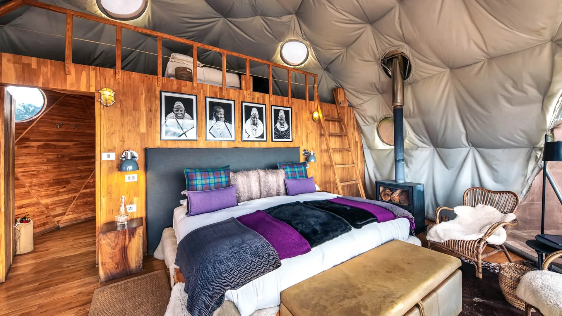 Canvas-and-perspex suites are warmed by an in-room wood-burning stove against the crater-rim chill.