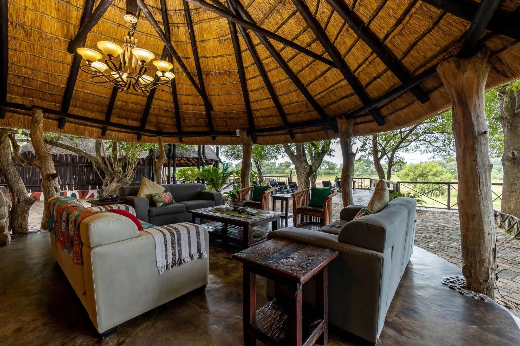The lodge's open-air thatched lounge, a relaxed spot between game drives.