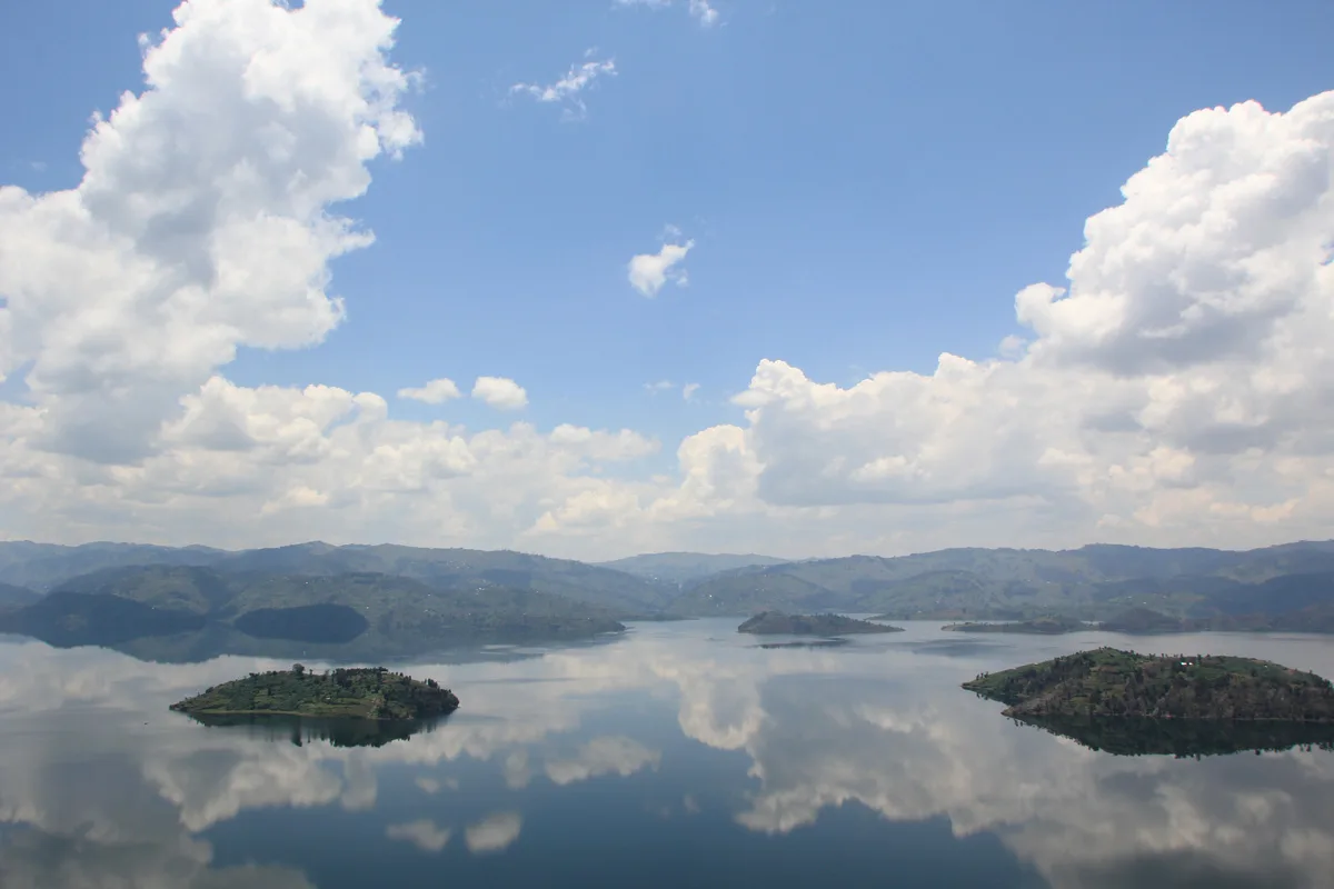 The still waters and islands of Lake Bulera, reflecting the sky below the lodge.