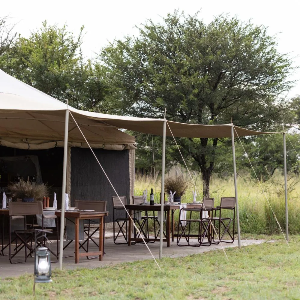 Dining tables beside the main tent