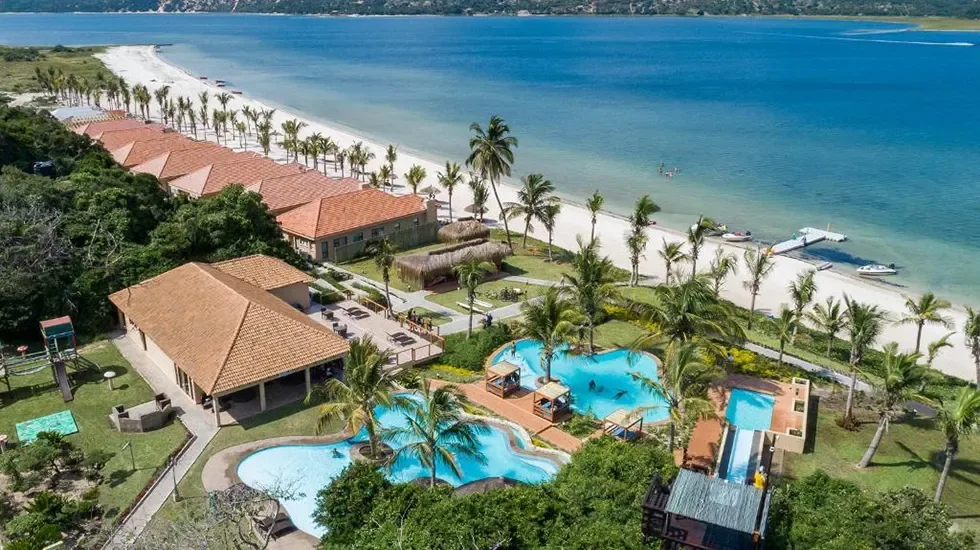 Beachfront resort and lagoon at Bilene, Mozambique, seen from above on a sunny day.