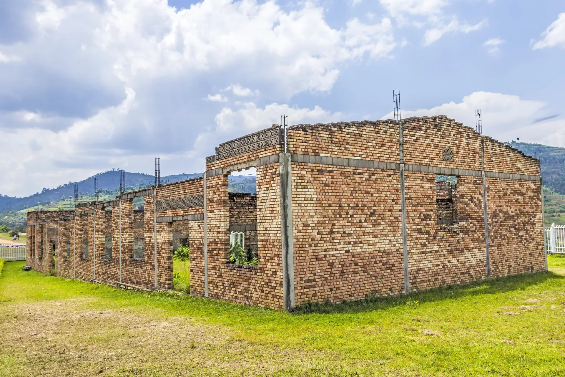 An unfinished brick building stands open to the sky near Butare, Rwanda.