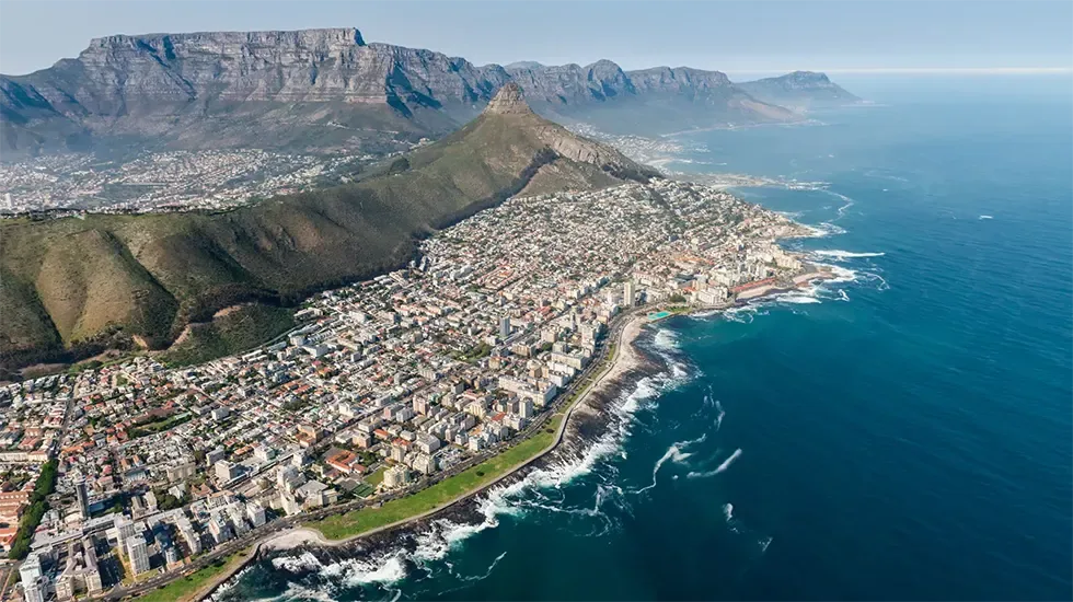 Cape Town's city bowl and coastline beneath Table Mountain and Lion's Head.