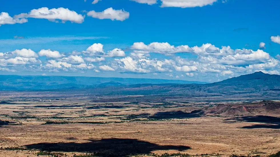 Cloud shadows drifting across the open plains of the Great Rift Valley in Kenya.
