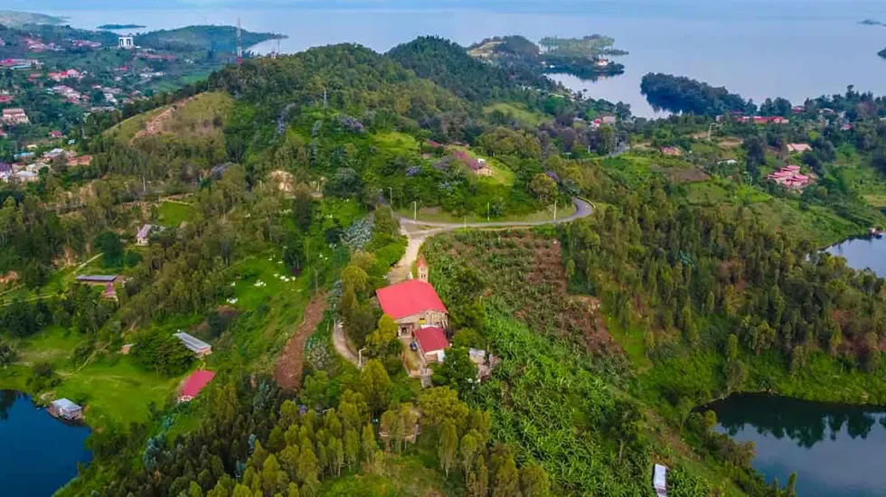 Green hills and red-roofed houses above the bays of Lake Kivu at Kibuye, Rwanda.